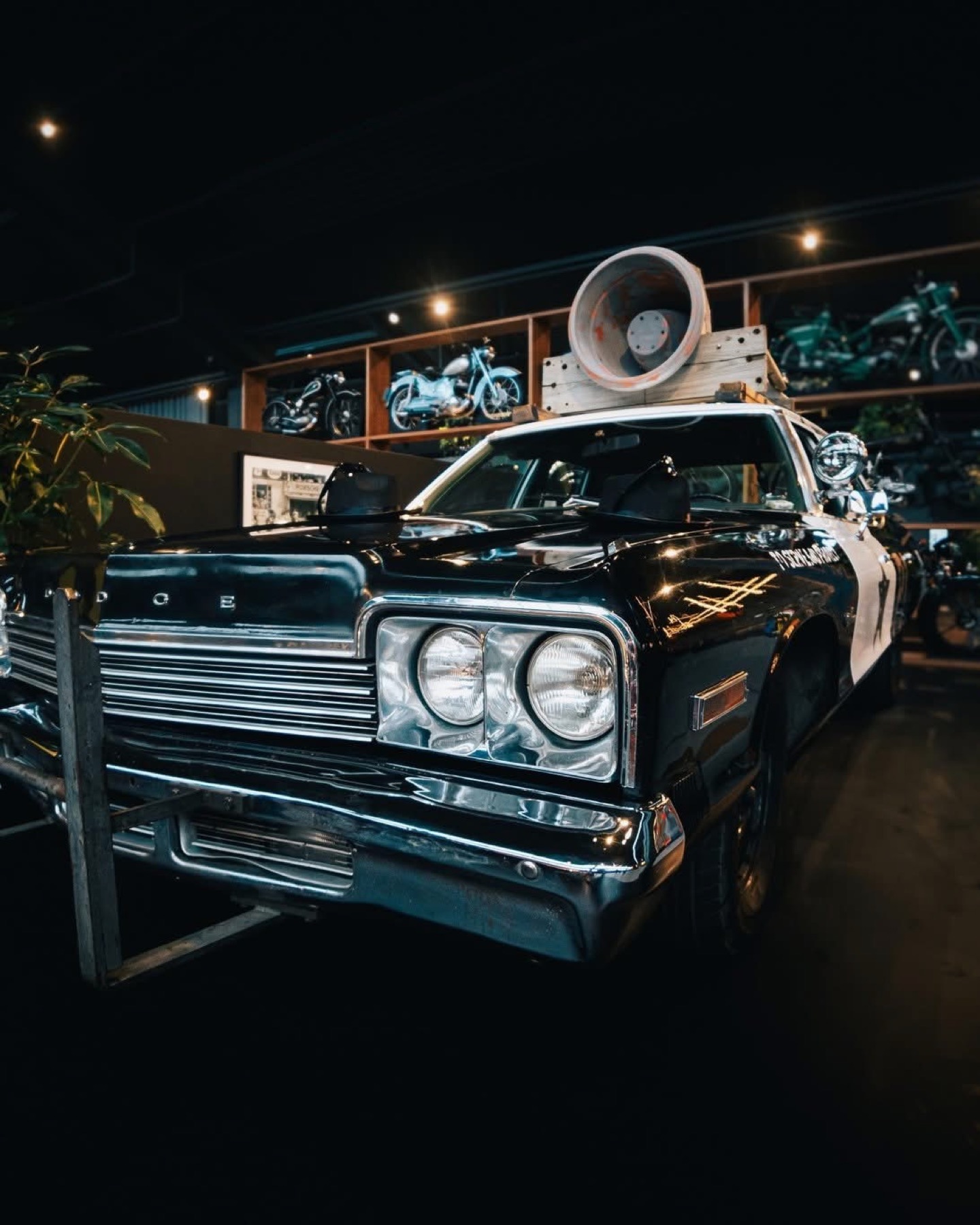 The Bluesmobile photographed indoors with its chrome and roof-mounted speaker visible