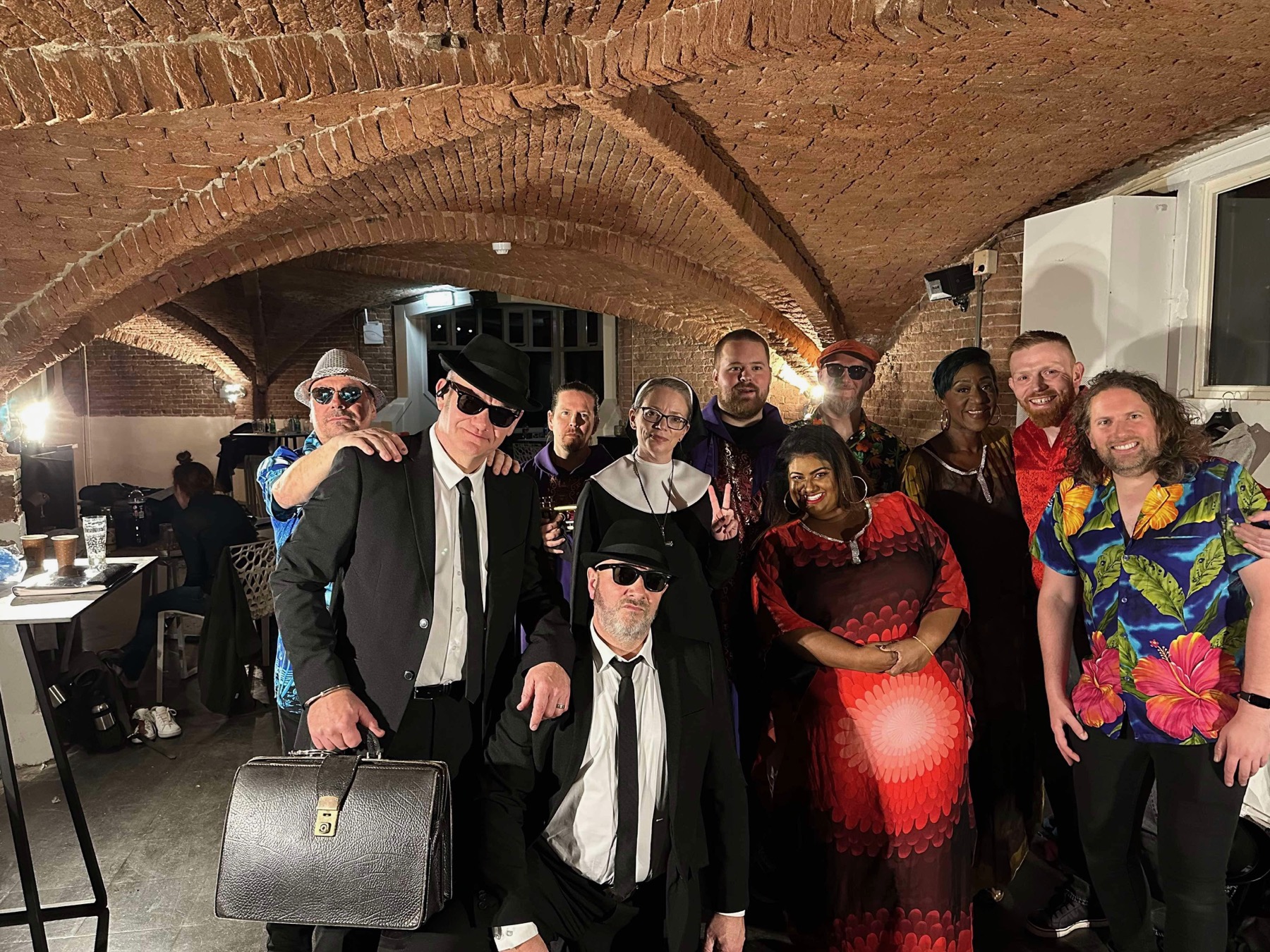 The full company of musicians and performers backstage