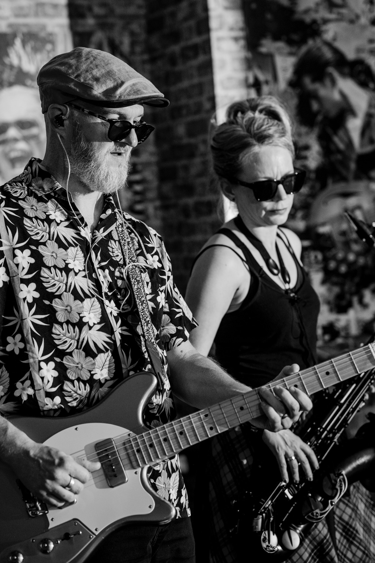 Guitarist and saxophonist performing together